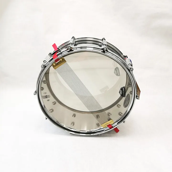 Snare from below: the snare wires show through the thin resonant head