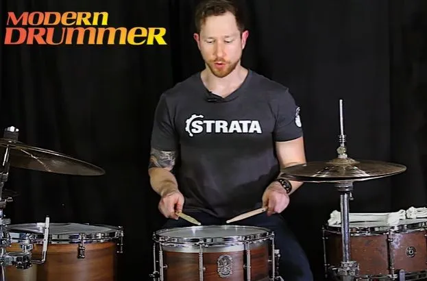 Drummer playing a snare set flat between the legs at a good height