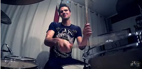 Drummer playing toms whose angle and height fit the natural position of the wrist