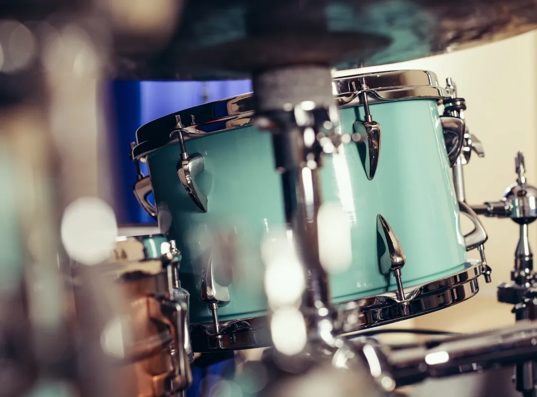 Close-up of a turquoise acoustic tom on its stand