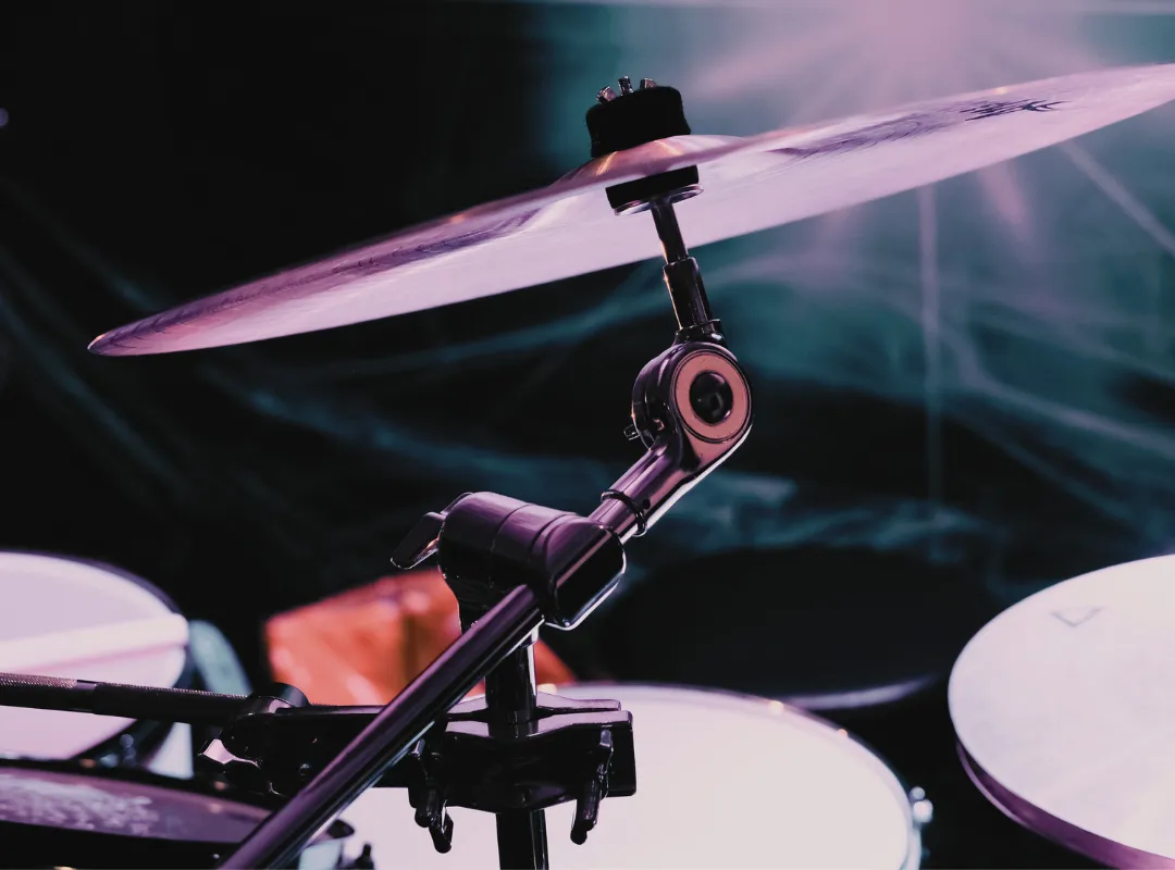 Cymbal at the end of a cymbal stand boom under stage lights