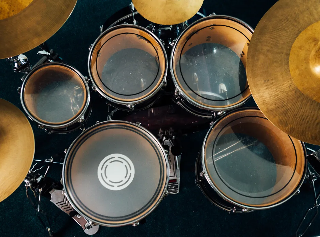 Drum kit from above: bass drum, snare, rack toms, floor tom and cymbals