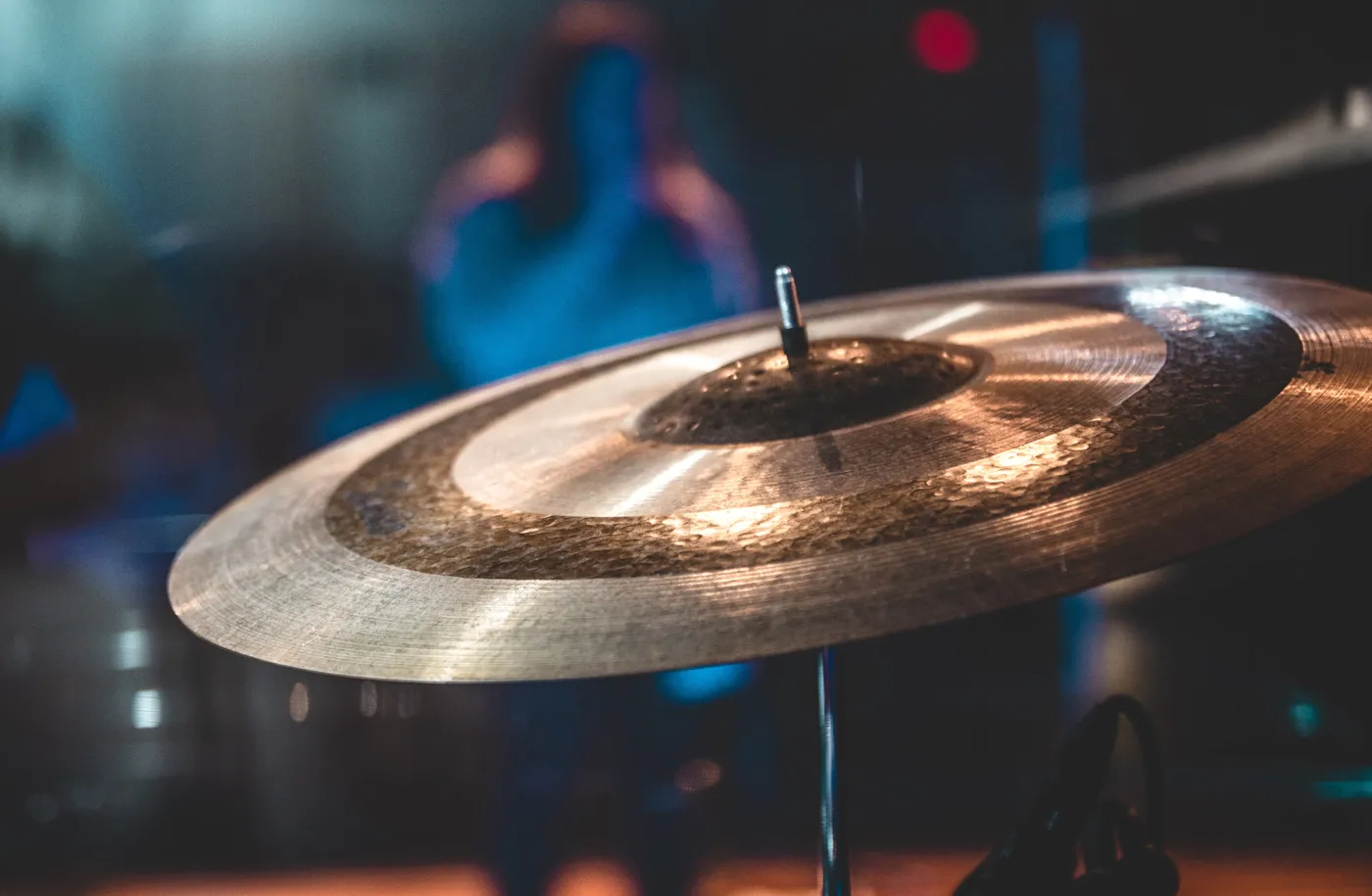 Close-up of a ride cymbal showing the bell and lathed grooves