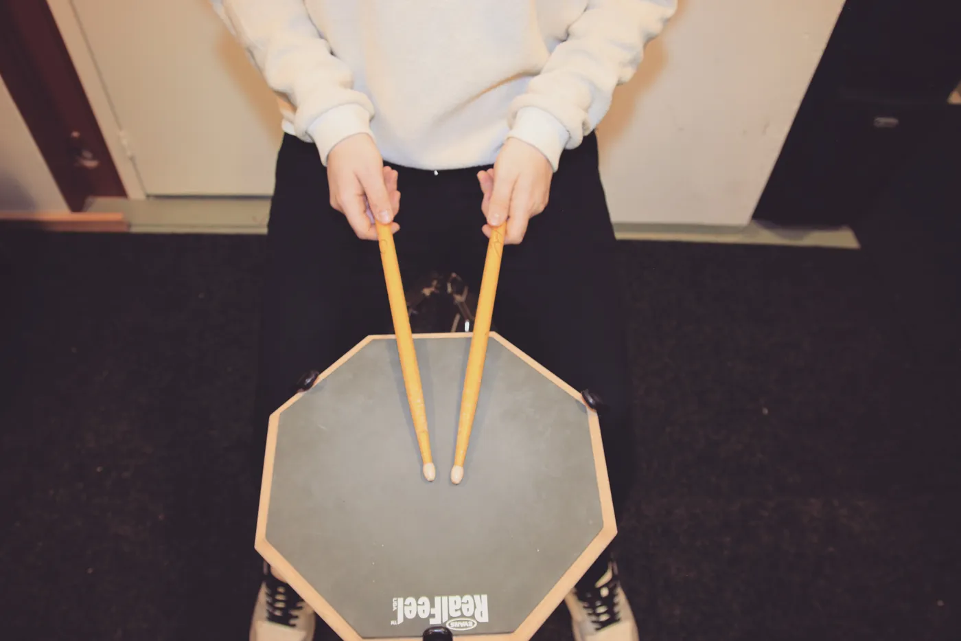 French grip on a practice pad: thumbs pointing up