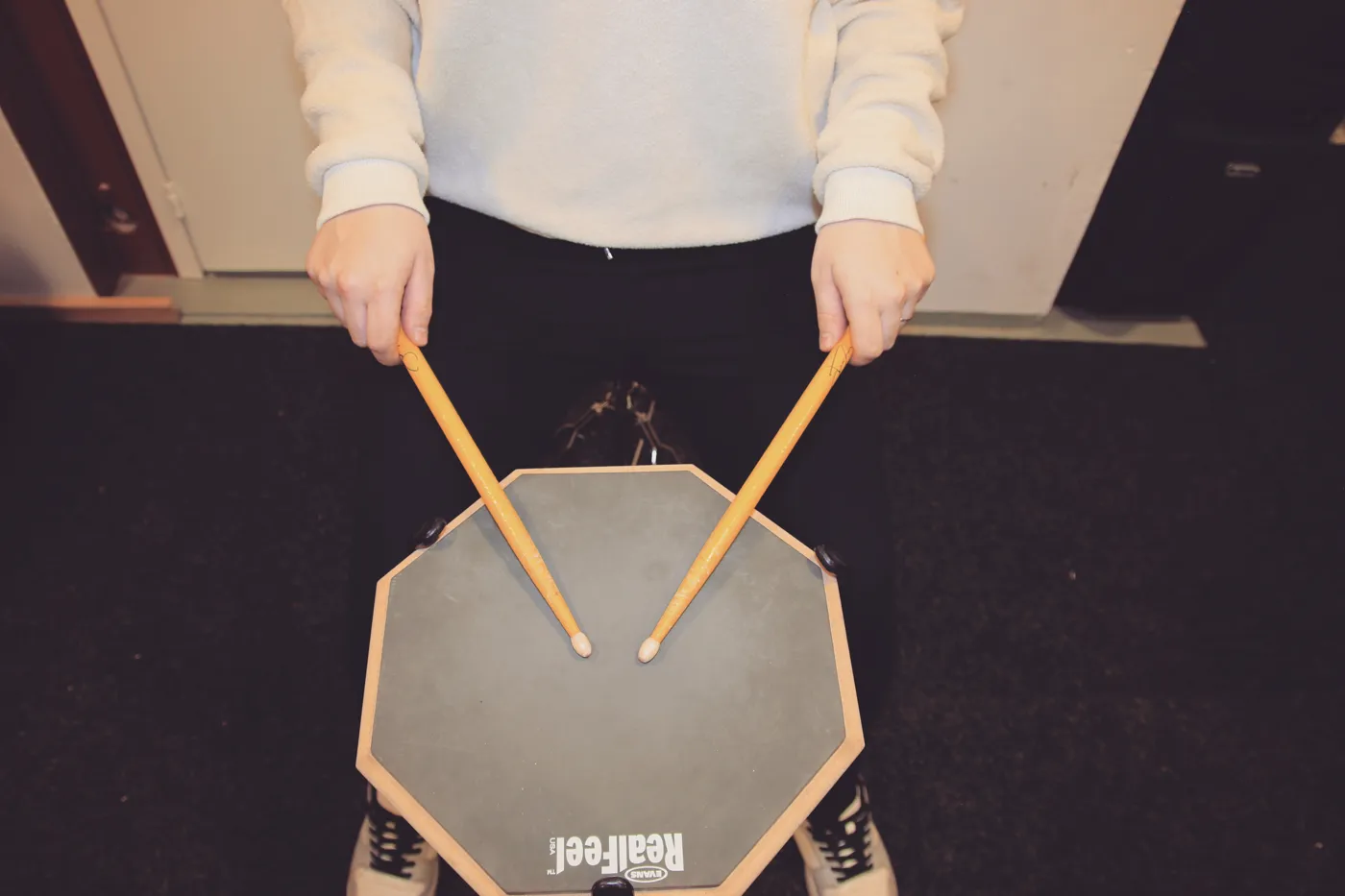 American grip on a practice pad: hands at about a 45-degree angle