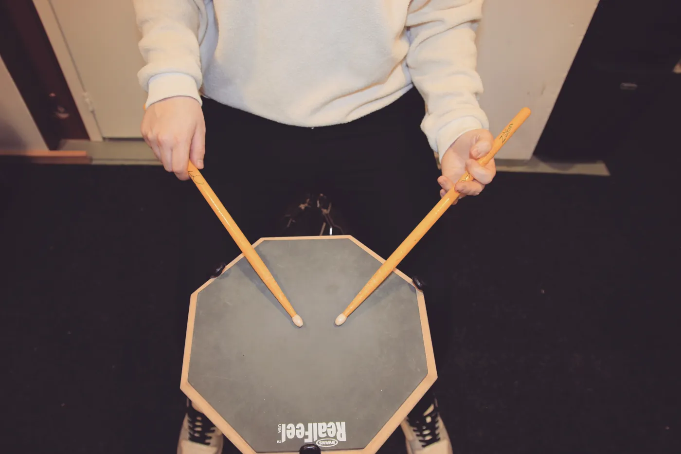 Traditional grip: the left-hand stick rests between the thumb and index finger