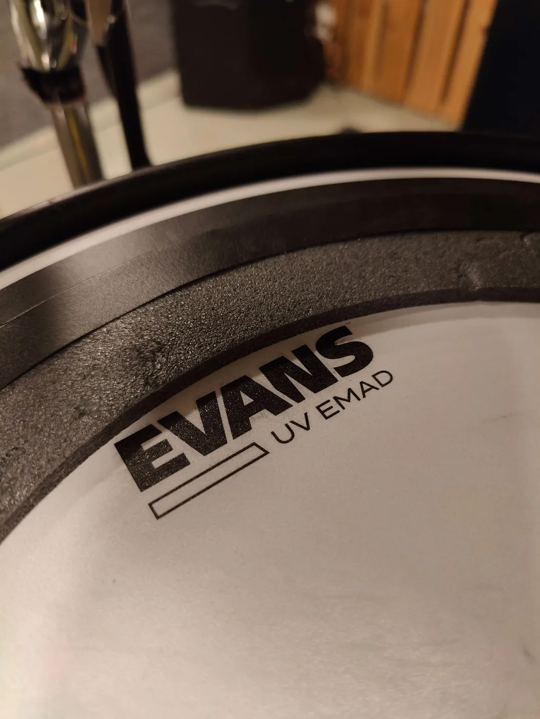 Close-up of an Evans UV EMAD bass drum head with its dampening ring